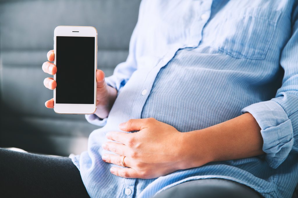 Pregnant woman with phone